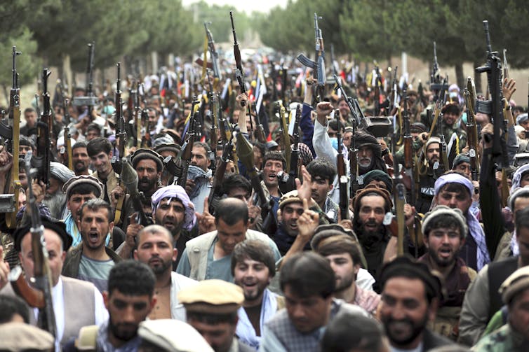 A crowd of Taliban fighters and supporters.
