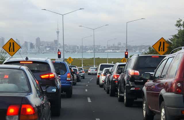 traffic jam on Auckland motorway with city in background