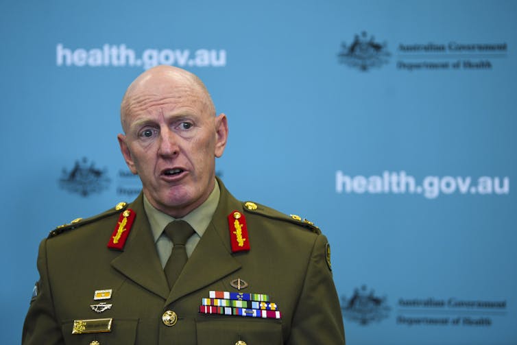 Lieutenant General John Frewen speaking to the media