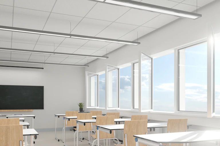 Empty classroom with all the windows open.