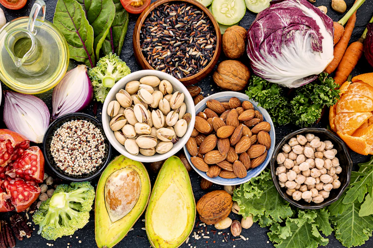 Variety of healthy foods, including nuts, berries and vegetables