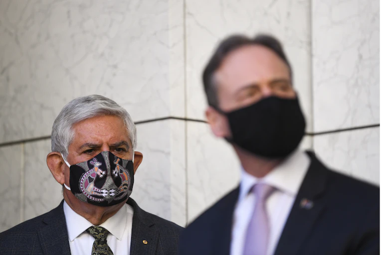 Ken Wyatt in the background, with Greg Hunt in the foreground