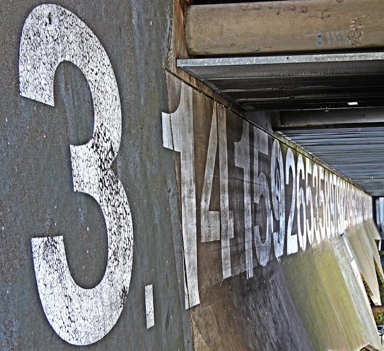 Pi written on roadside concrete fence