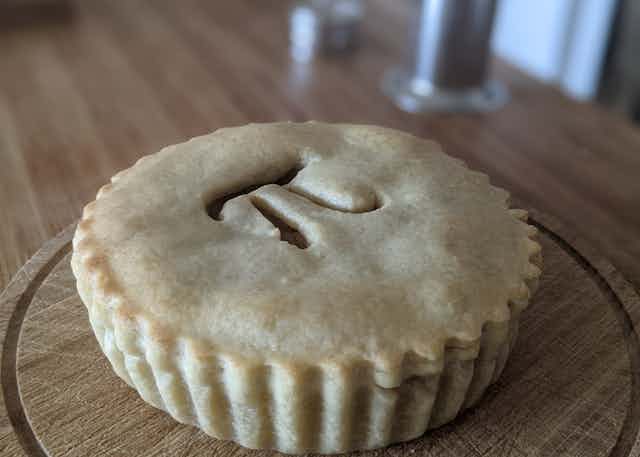Pie with a pi symbol on top