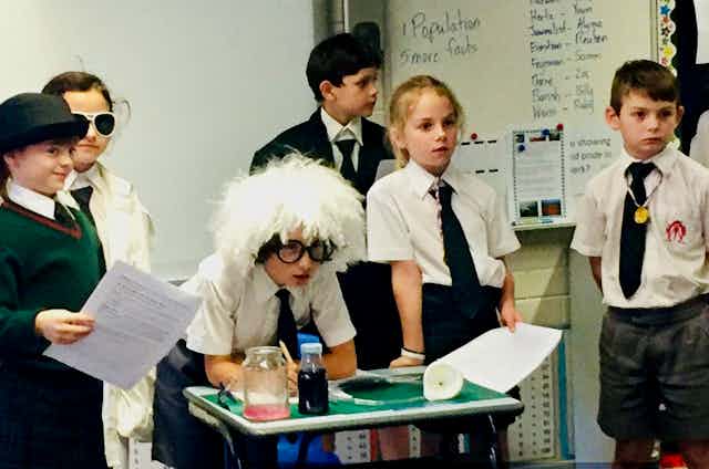 Primary school students perform in a play about Einsteinian science