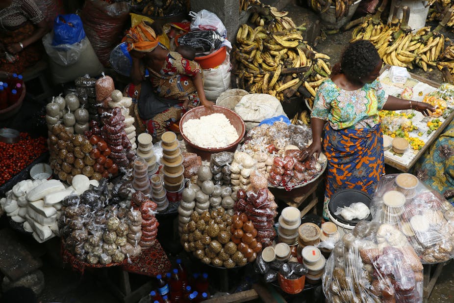 Women selling food at the Adjame food market in Abidjan, Ivory Coast,