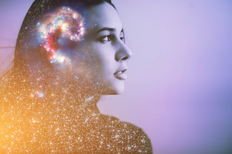 Brain, consciousness concept inside woman's head on purple background.