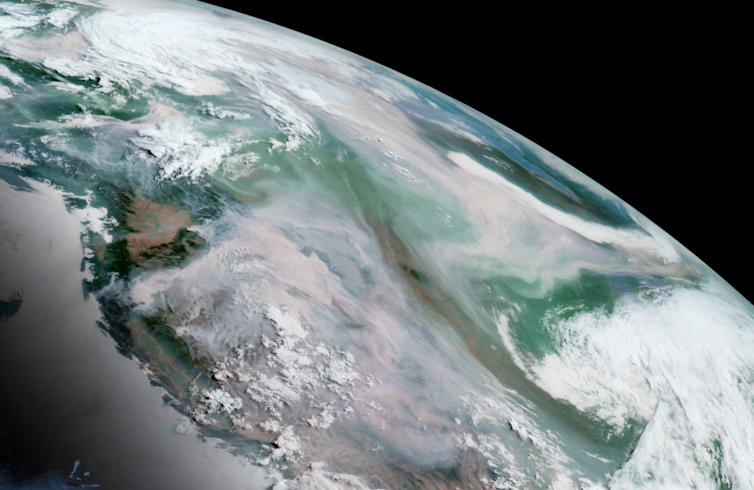 Satellite view of the Earth and wildfire smoke