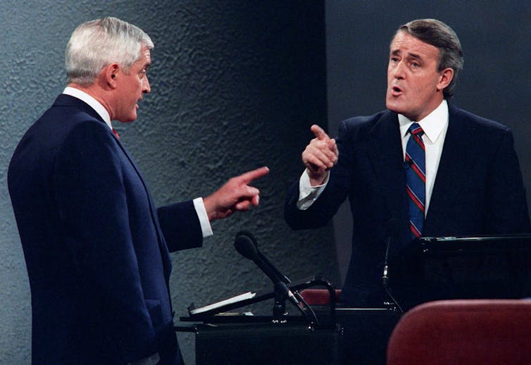 John Turner and Brian Mulroney point fingers at one another during a debate.
