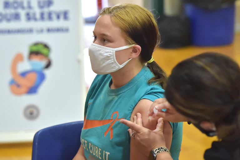 Junior Molly Day gets her first Pfizer Biontech COVID vaccine at Ridley High School Monday afternoon May, 3, 2021 as part of a clinic for students age 16-18.