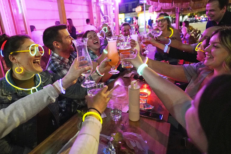 Young people drinking in a bar.