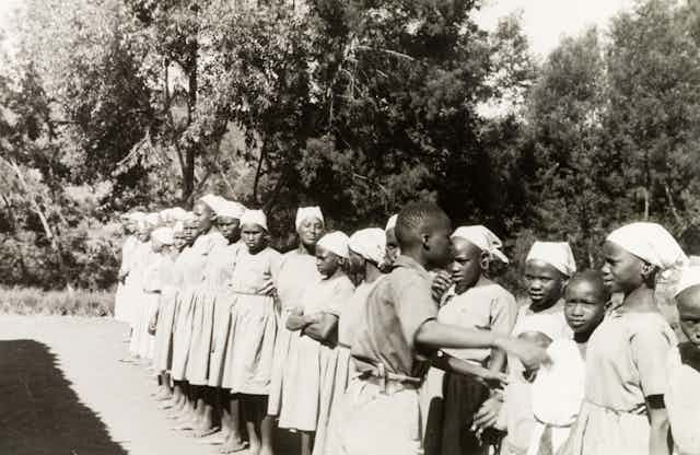 A group of young women in a line. 
