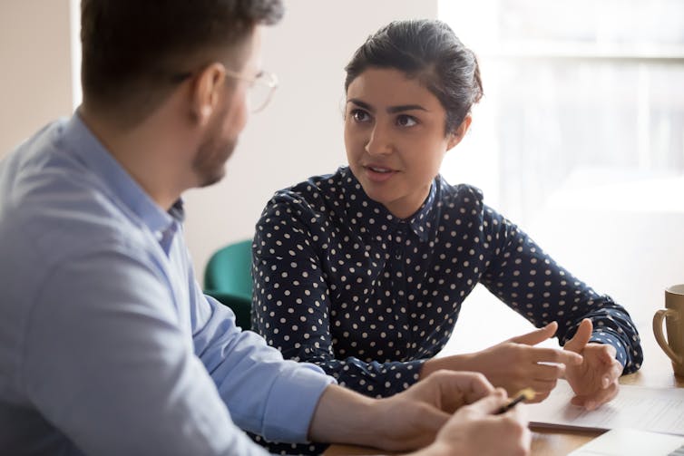 two people talking in an office
