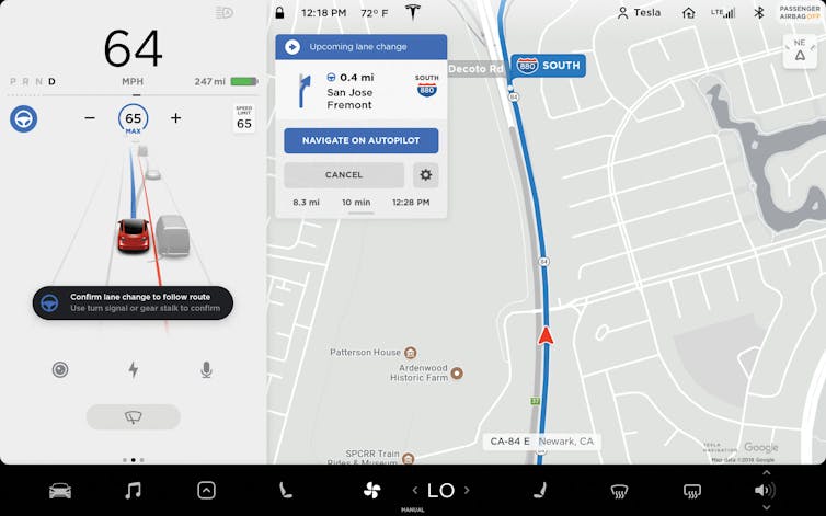 Screenshot of a display with the left third showing an icon of a car on a road and the right to third showing a map
