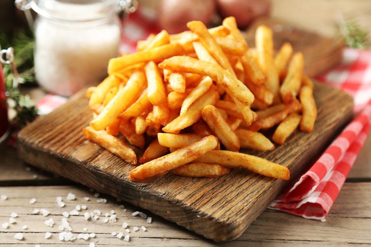 A serving of chips on a board.