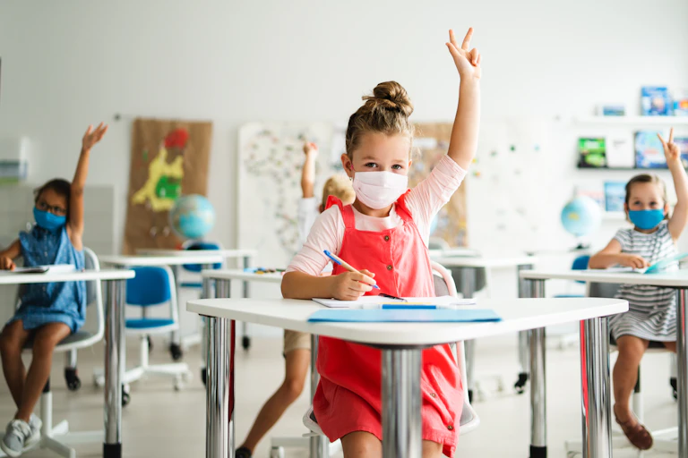 Children with facemasks in classroom