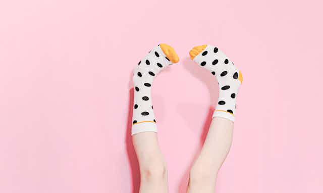 feet in polka dot socks pointing upwards