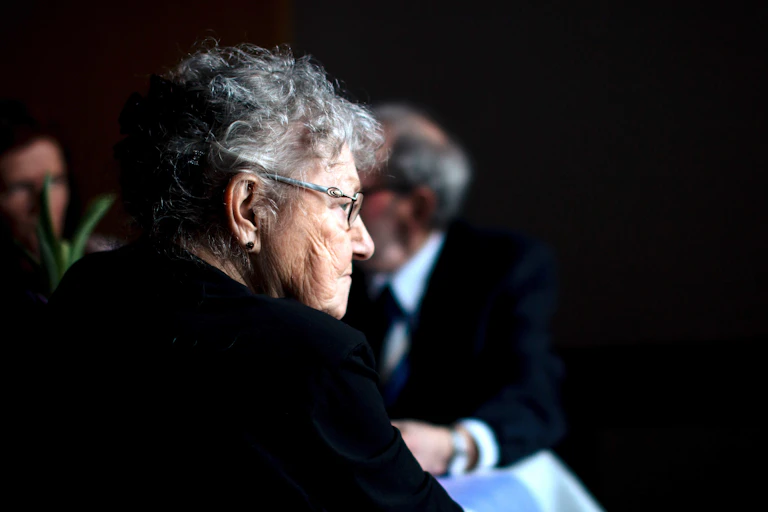 Old woman looking isolated in a public place