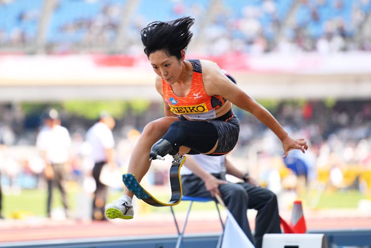 Japanese long jumper Saki Takakuwa mid-jump