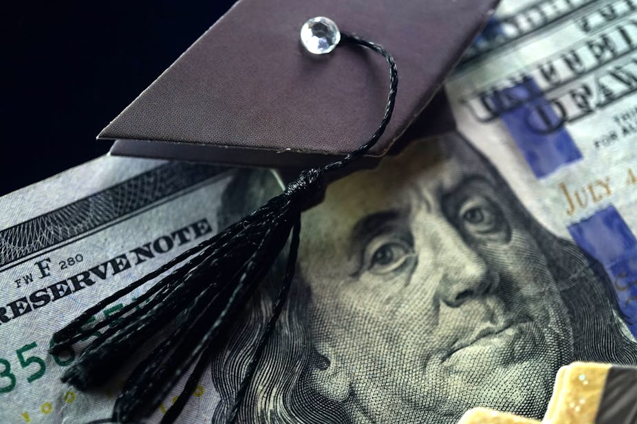 Image of Benjamin Franklin on U.S. currency wearing a black graduation cap.