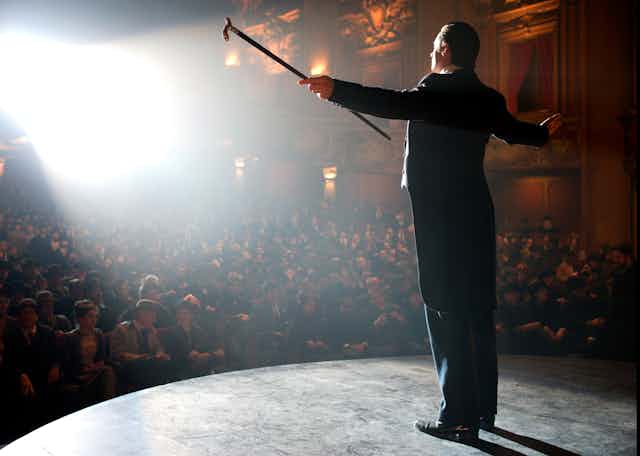 Magician on stage.