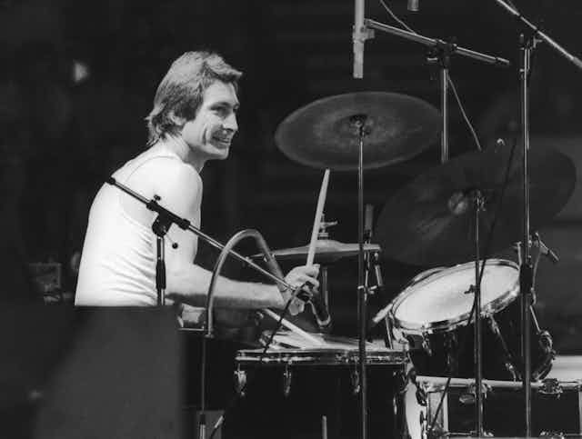 Drummer Charlie Watts of the Rolling Stones sitting behind his kit.