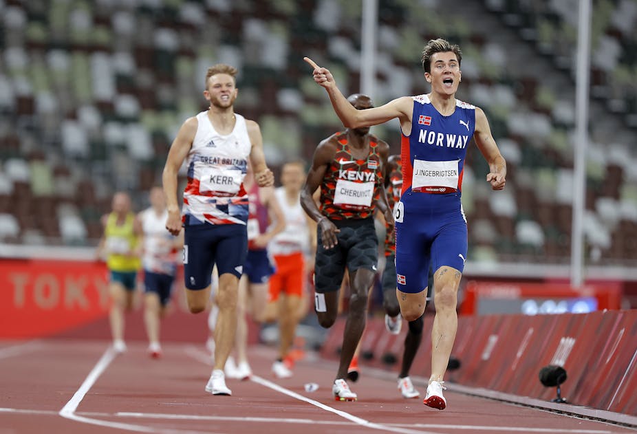 Jakob Ingebrigtsen of Norway crossing the finish line in first place at the Tokyo 2020 Olympics.