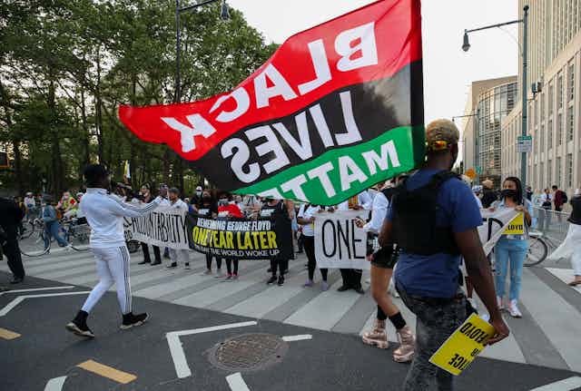 BLM protesters marched on streets and crossed from the Brooklyn Bridge to Manhattan for the one-year anniversary of George Floyd's death in New York City, United States on May 25, 2021.