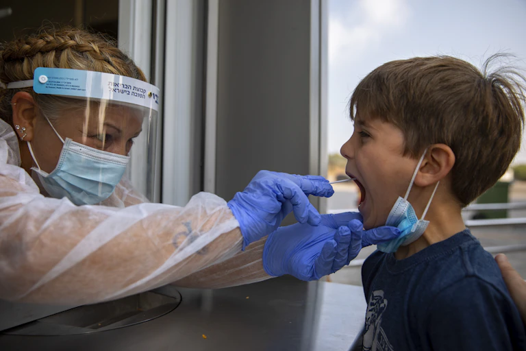 A child gets a COVID-19 test