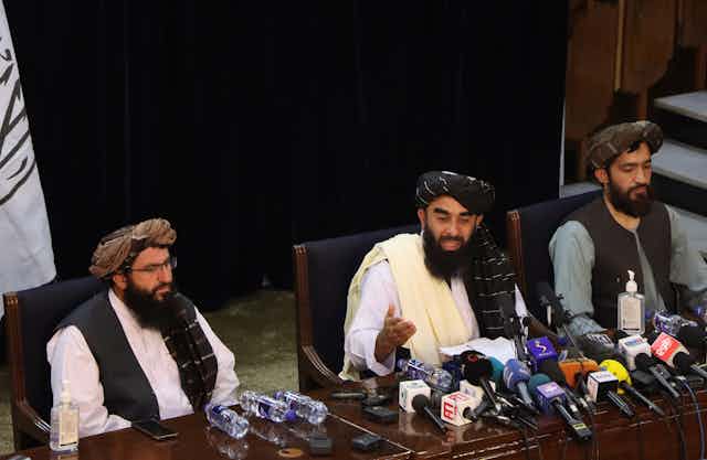 Three senior Taliban leaders at a press conference in Kabul, August 17 2021.