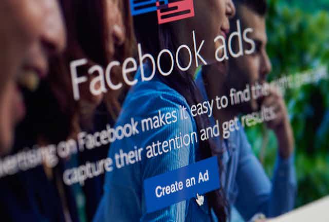Photo of a computer screen reading FACEBOOK ADS CREATE AN AD