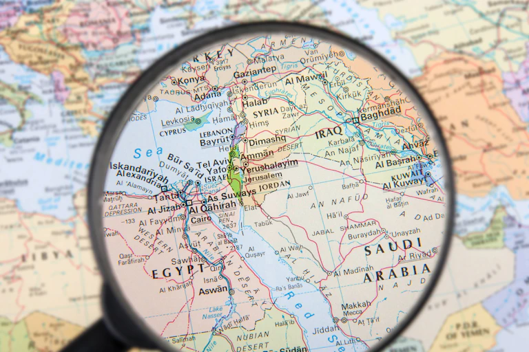 A map of the Middle East under a magnifying glass..