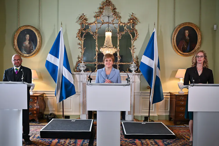 First Minister Nicola Sturgeon and Scottish Green Party co-leaders Patrick Harvie and Lorna Slater at a press conference.
