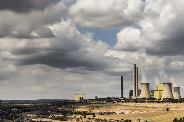 coal plant under cloudy sky