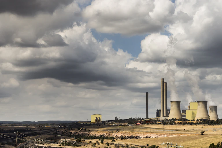 coal plant under cloudy sky