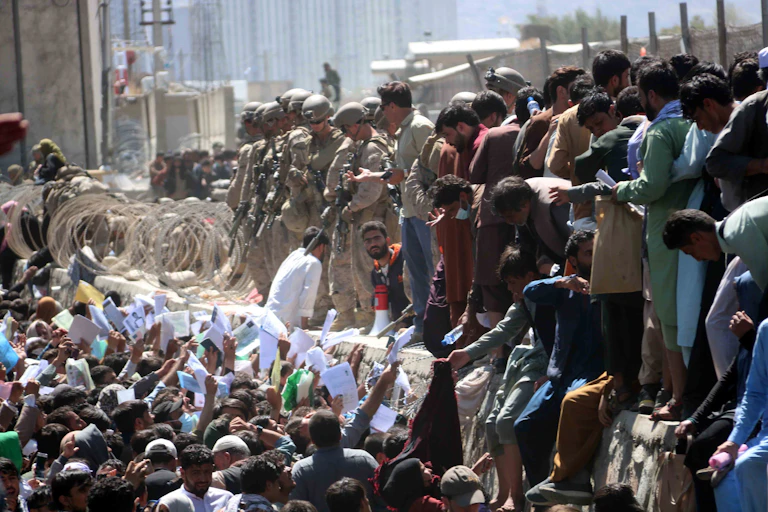 Afghans crowd Kabul airport, trying to get out of the country.