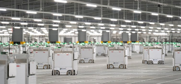Coles and Woolworths are moving to robot warehouses and on-demand labour as home deliveries soar