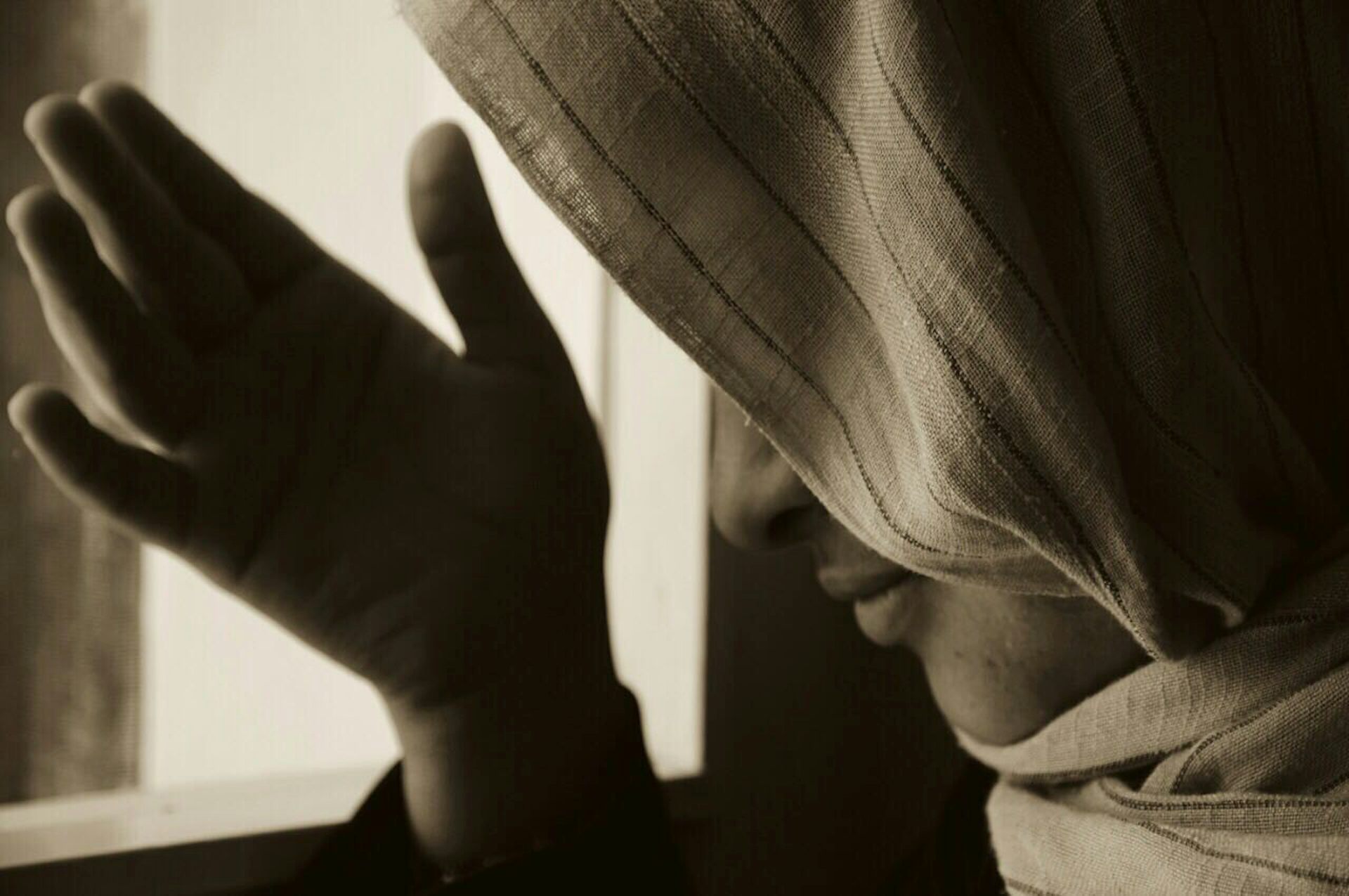 An Afghan woman wearing a head covering.