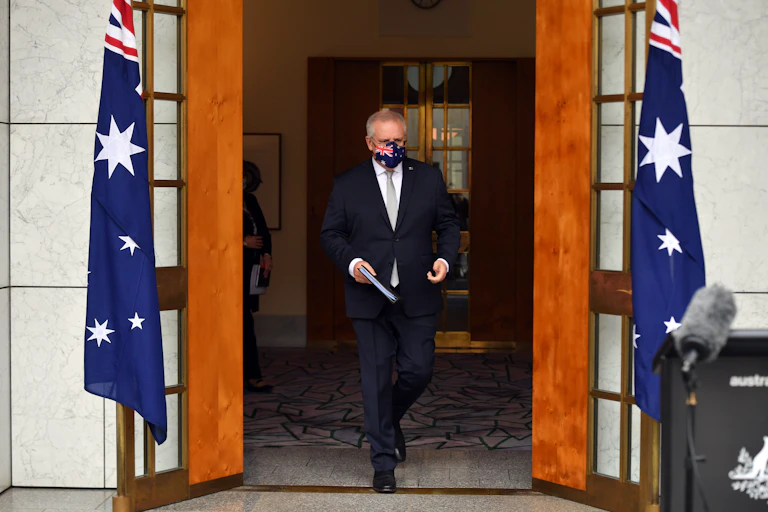 Prime Minister Scott Morrison wearing mask walking towards awaiting press in Canberra