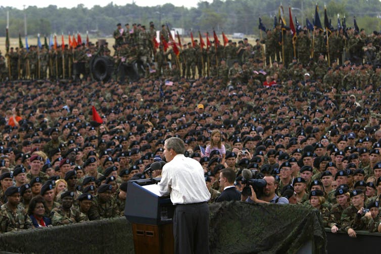 President George W. Bush addressing US troops.