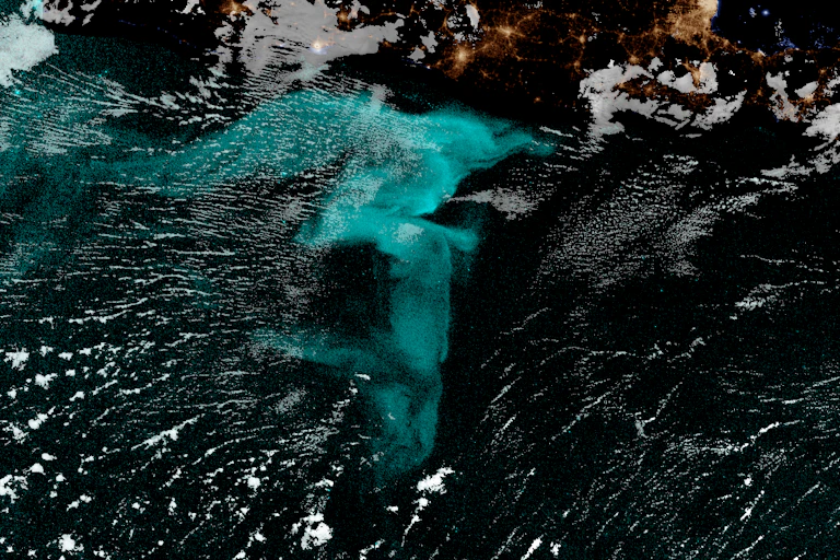A satellite image of a question mark–shaped blue area of ocean off the coast of Java.