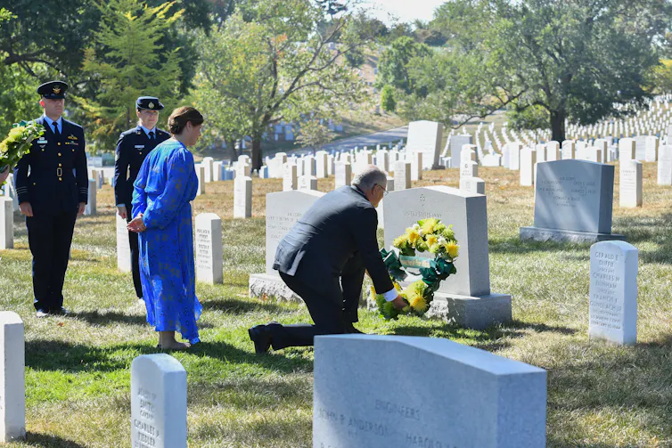 Scott Morrison lays a wreath at the tomb of an Australian pilot.