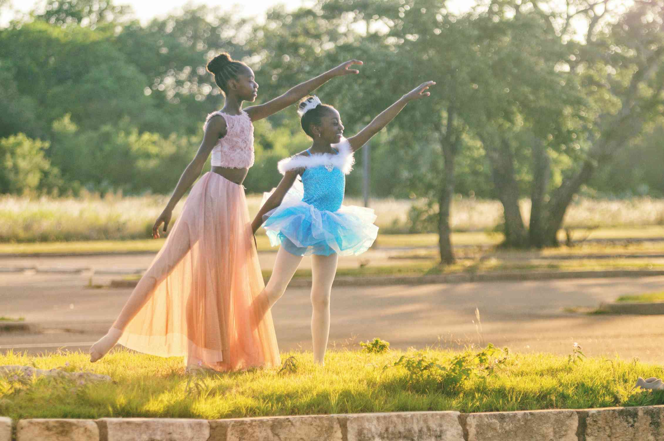 Two young Black girls dancing