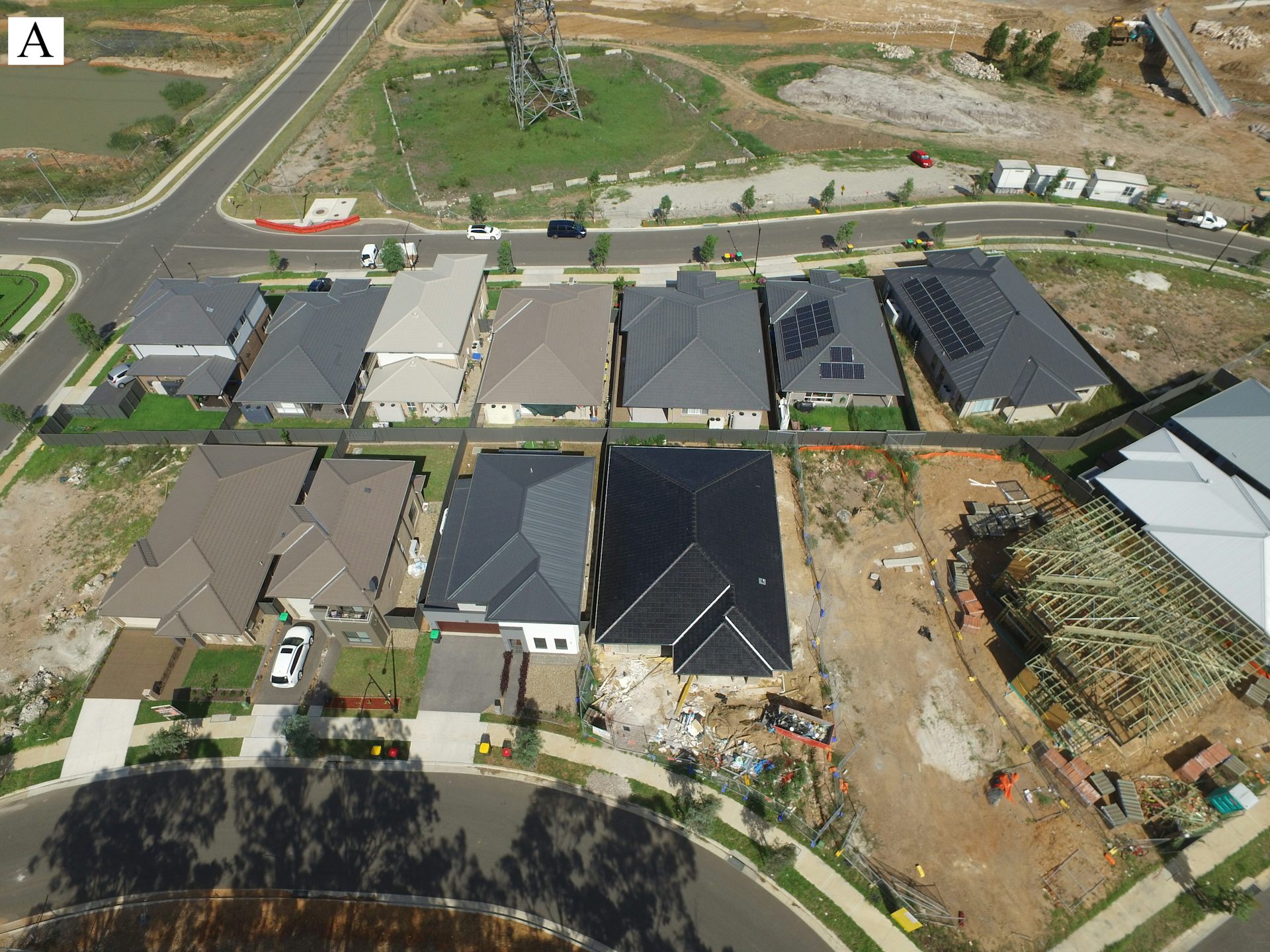 A group of homes with predominantly dark roofs