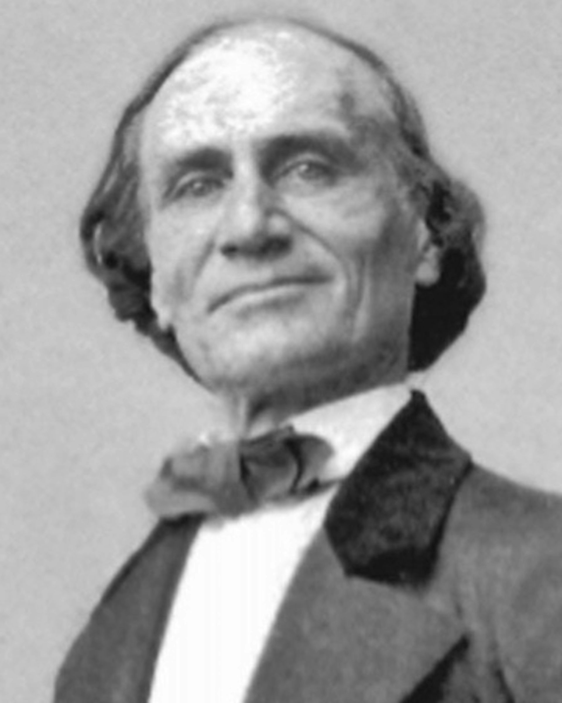A black and white portrait of a man.