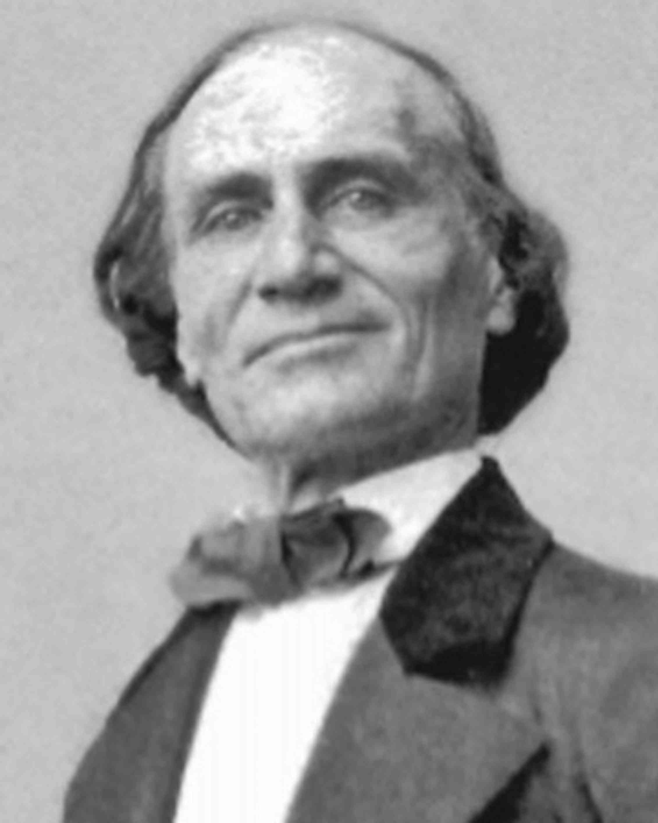 A black and white portrait of a man.
