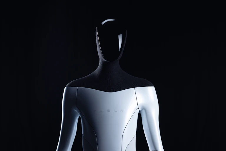 Head and torso of a humanoid robot with the name Tesla on its chest