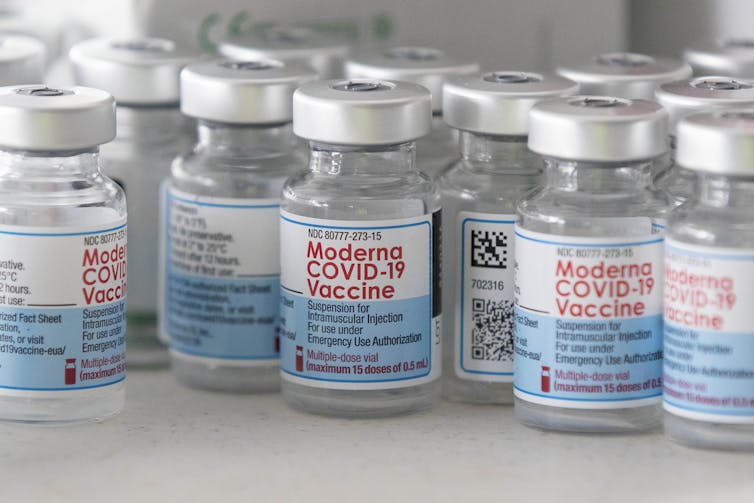 Empty vials of Moderna's COVID-19 vaccine