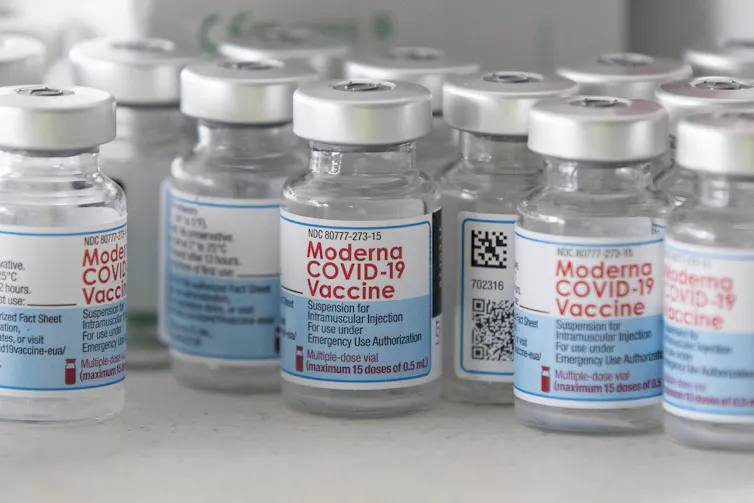 Empty vials of Moderna's COVID-19 vaccine