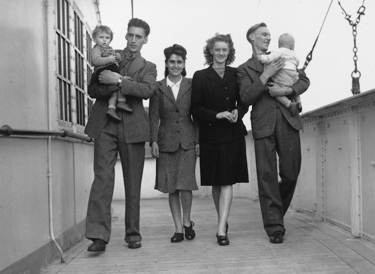 Families on a ship leaving England in 1947 to build homes for the Australian government in New South Wales.